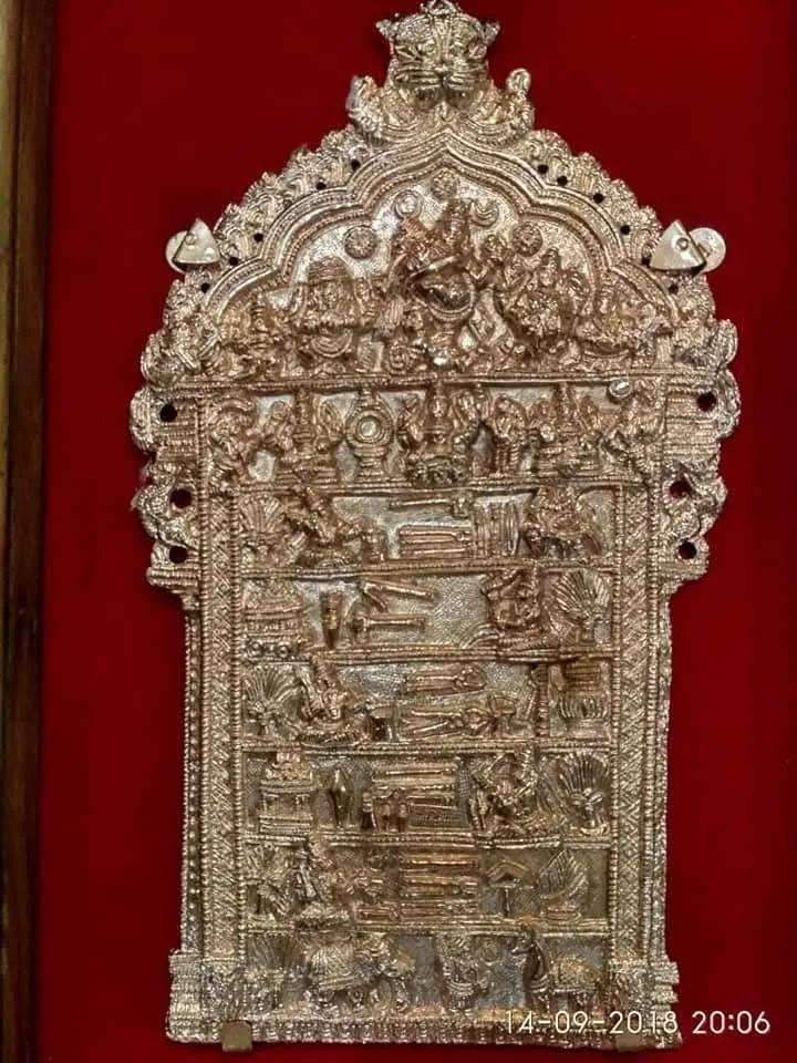 An ornate silver piece on red velvet, from Babu Lal Marotia’s awards