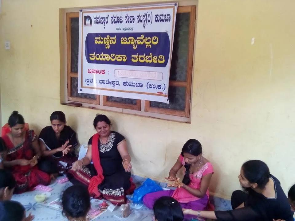 Women making clay jewellery by hand at the workshop in Dhareshwar, Kumta