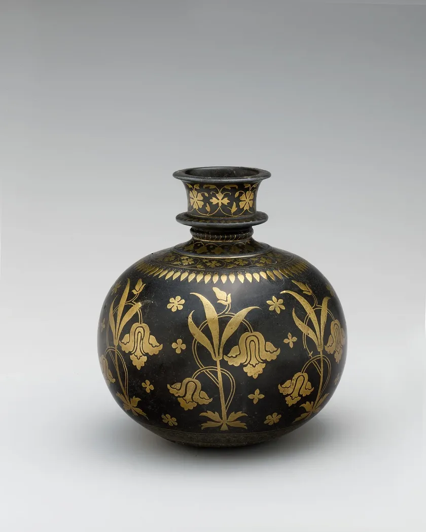 A bidriware vessel in blackened metal, inlaid with gold flowering vines